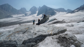 Students take a break from performing GPR data collection on the Dinwoody Glacier. Photo by Kyle Nicholoff
